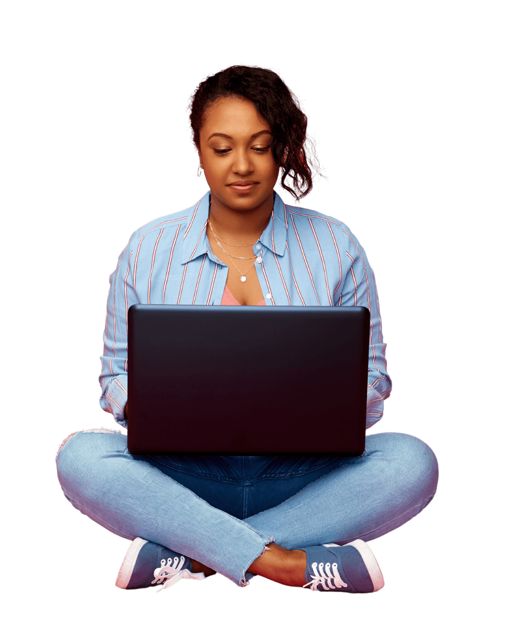 A person sitting cross-legged with a laptop
